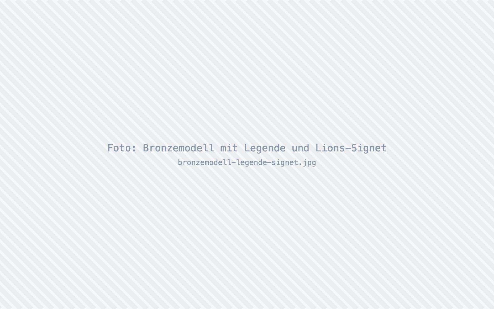 Foto: Bronzemodell mit Legende und Lions-Signet